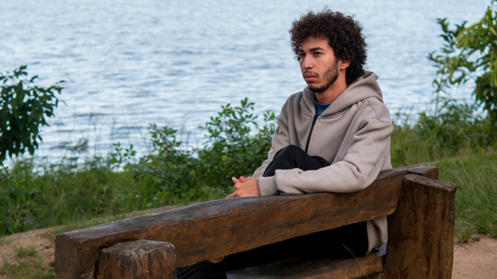 Man sitting alone, reflecting emotional loneliness in a connected world