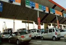 Car using FASTag toll pass for annual highway travel