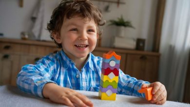 Child arranging colorful number blocks