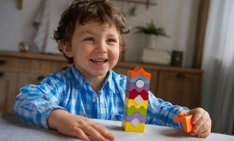 Child arranging colorful number blocks