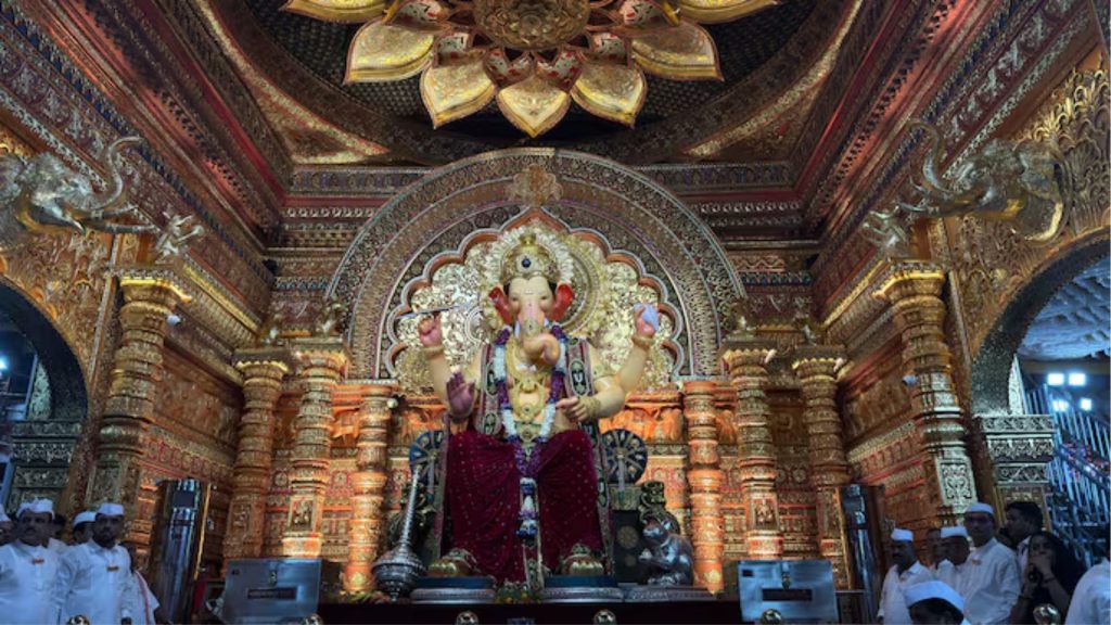 Devotees offer prayers at Lalbaugcha Raja during Ganesh Chaturthi 2025.