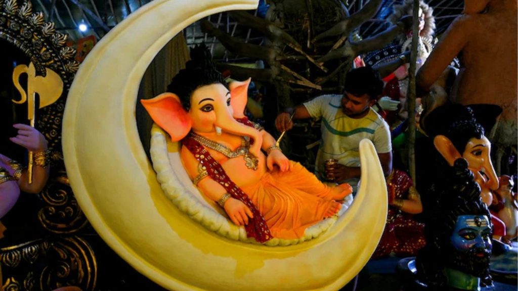Artisan hand-paints Lord Ganesha idol ahead of Ganesh Chaturthi 2025.